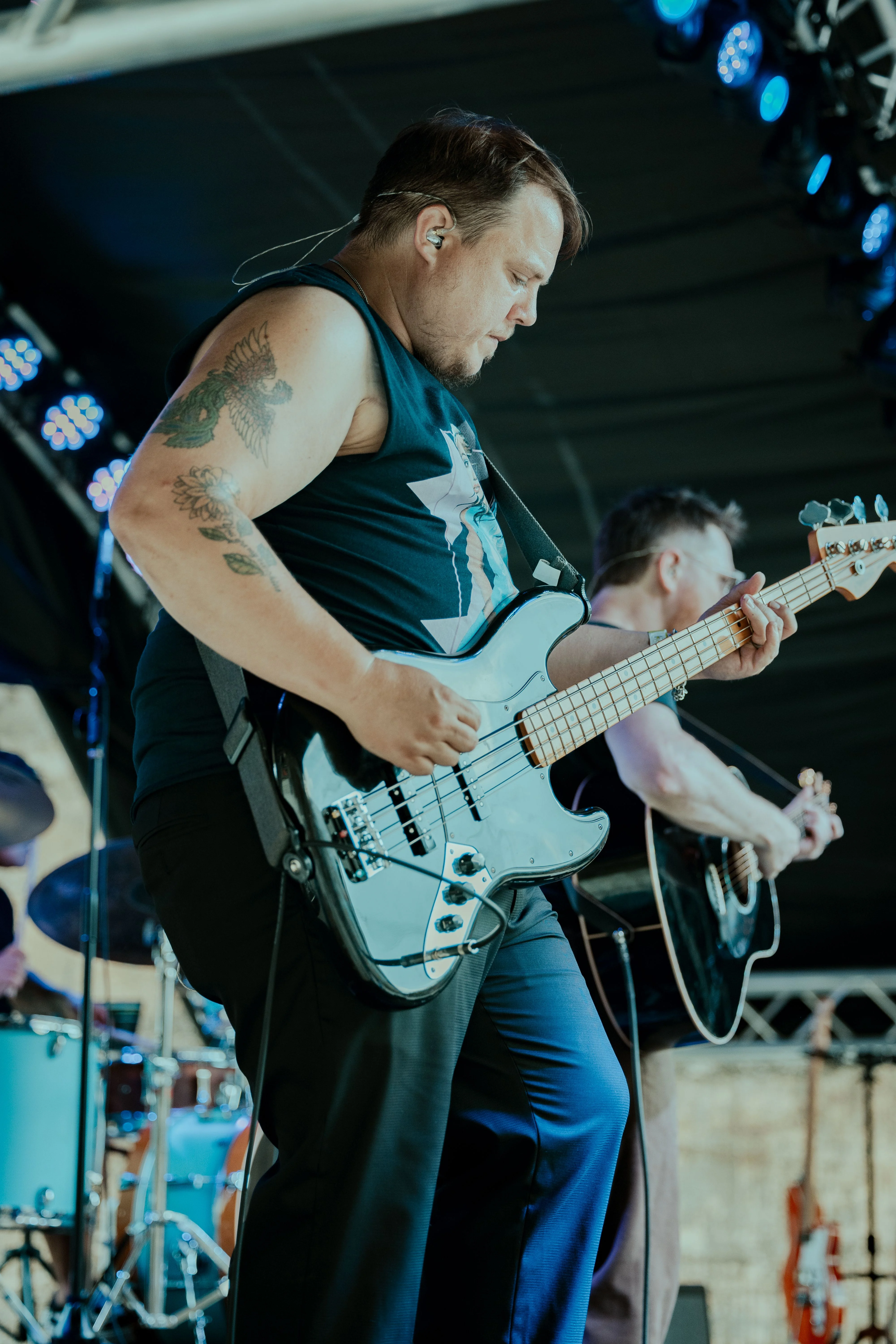 Daniel playing bass in a close stage view