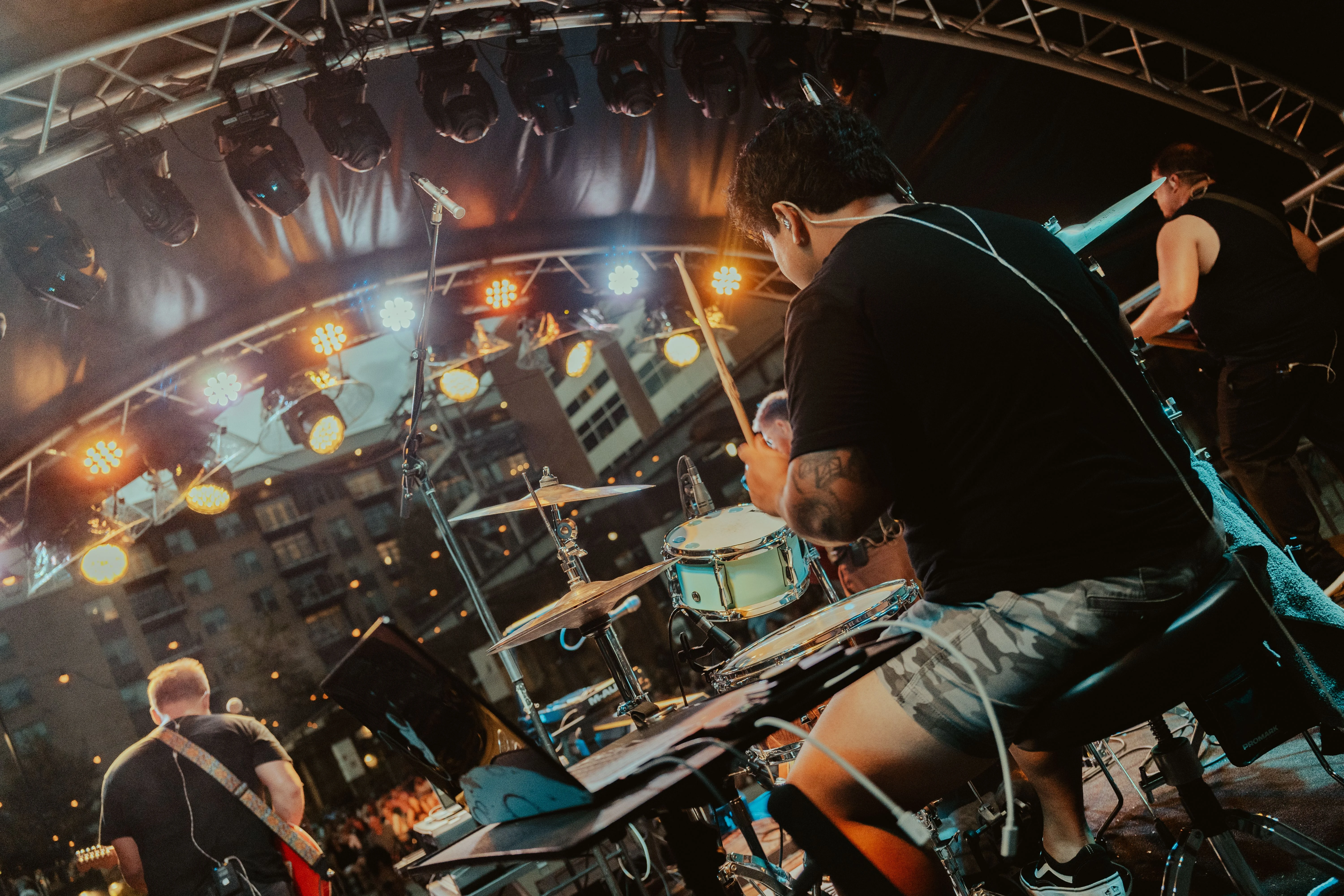 Rod playing drums from behind the stage