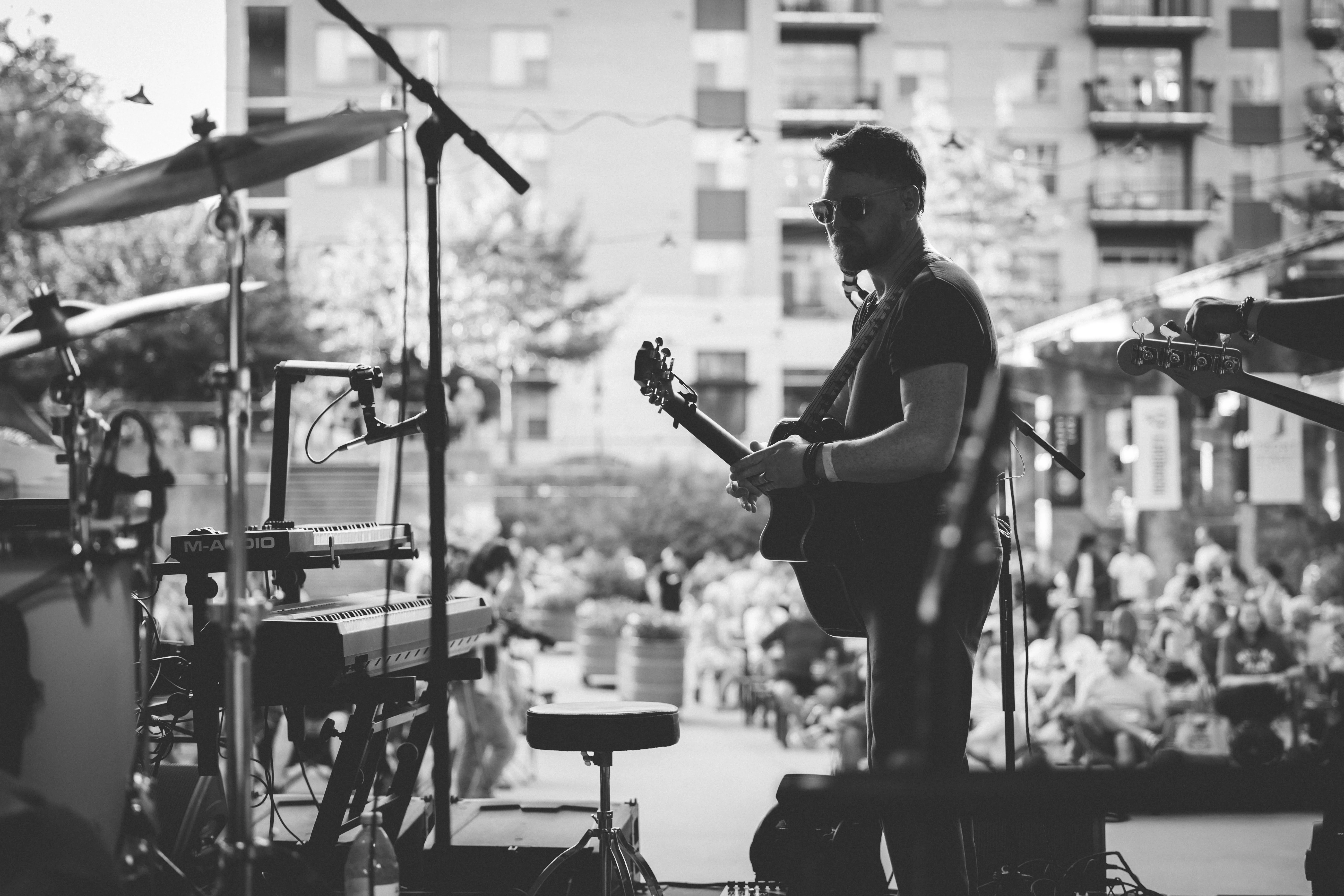 Scott onstage in black and white