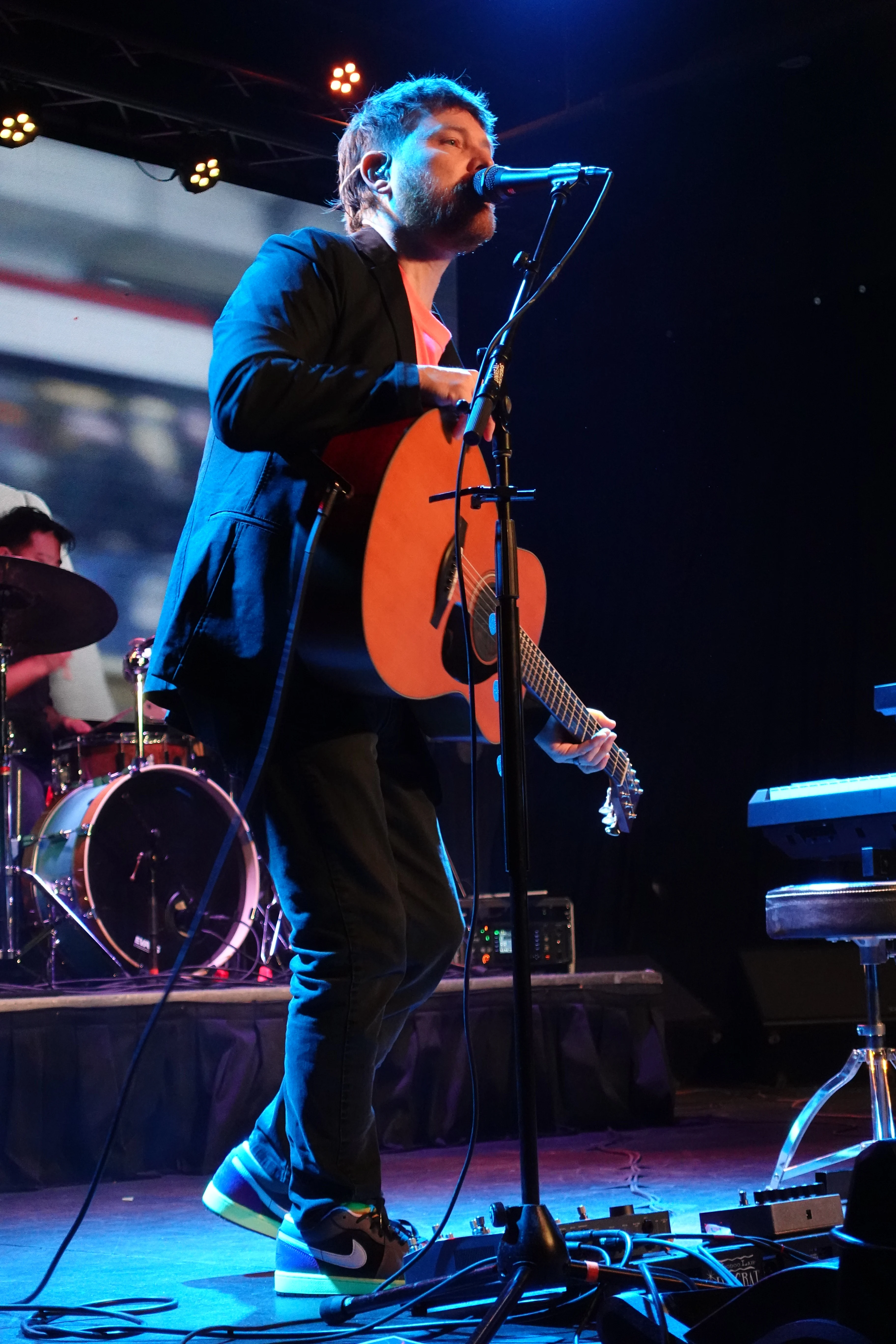 Scott singing and playing acoustic guitar with Back To The Start